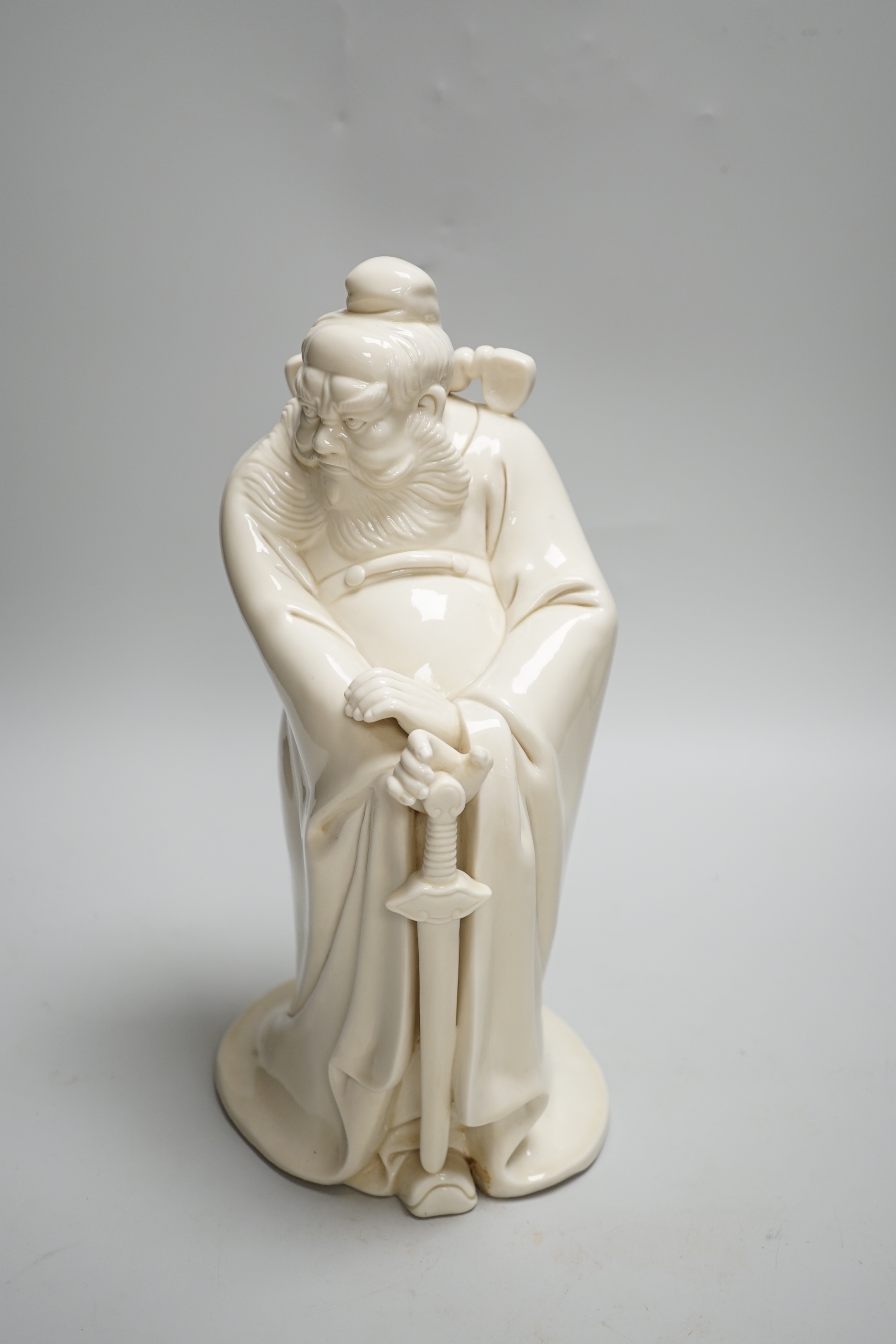 A large Chinese blanc de chine of Zhong Kui, the Devil Chaser, probably Republic, seal mark to the reverse, 30cm high